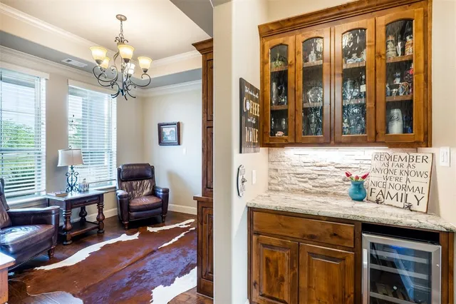 a view of a livingroom with workspace and a window