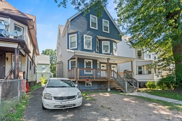 a car parked in front of a house
