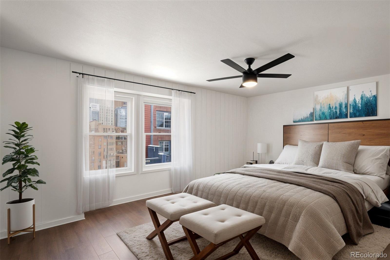 2883 Central Park Boulevard Denver, CO 80238 - Photo 14 of 27 a bedroom with a bed window and couch