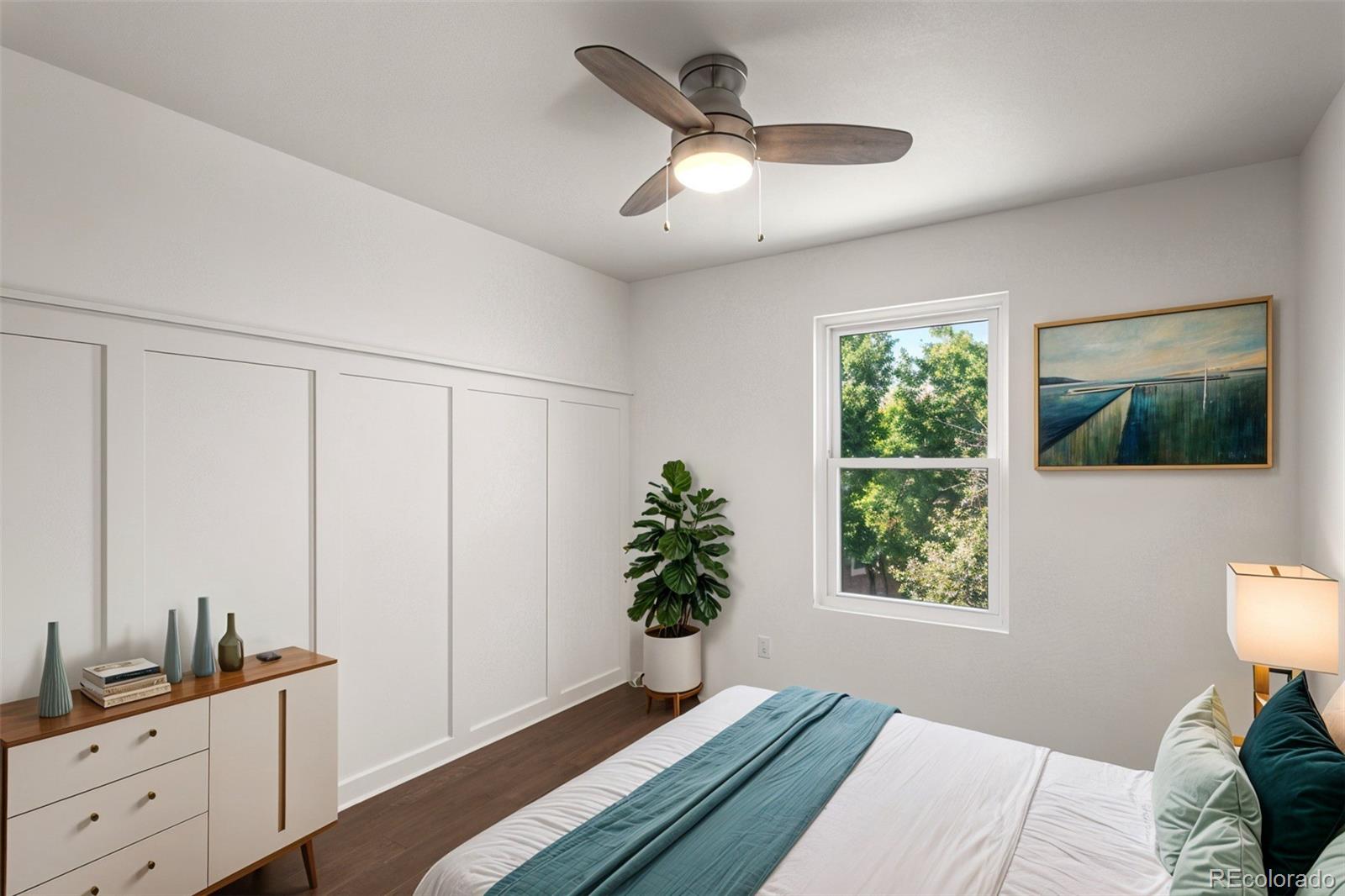 2883 Central Park Boulevard Denver, CO 80238 - Photo 19 of 27 a bedroom with a bed and a window