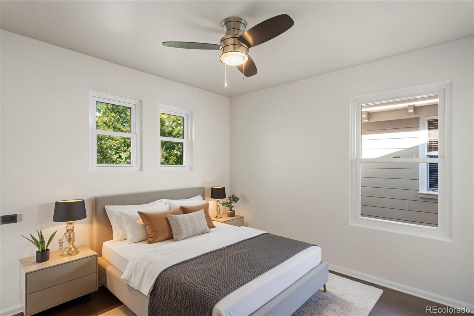 2883 Central Park Boulevard Denver, CO 80238 - Photo 22 of 27 a bedroom with a bed and a window