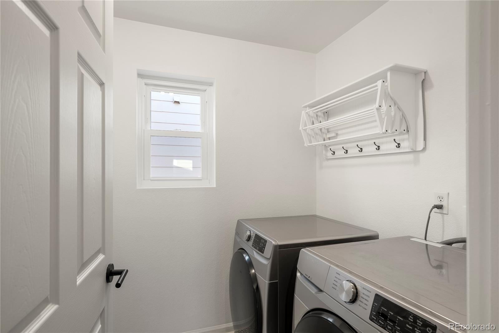 2883 Central Park Boulevard Denver, CO 80238 - Photo 23 of 27 a utility room with dryer and washer
