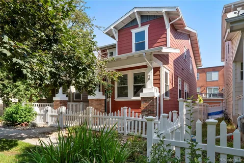 a front view of a residential apartment building with a yard