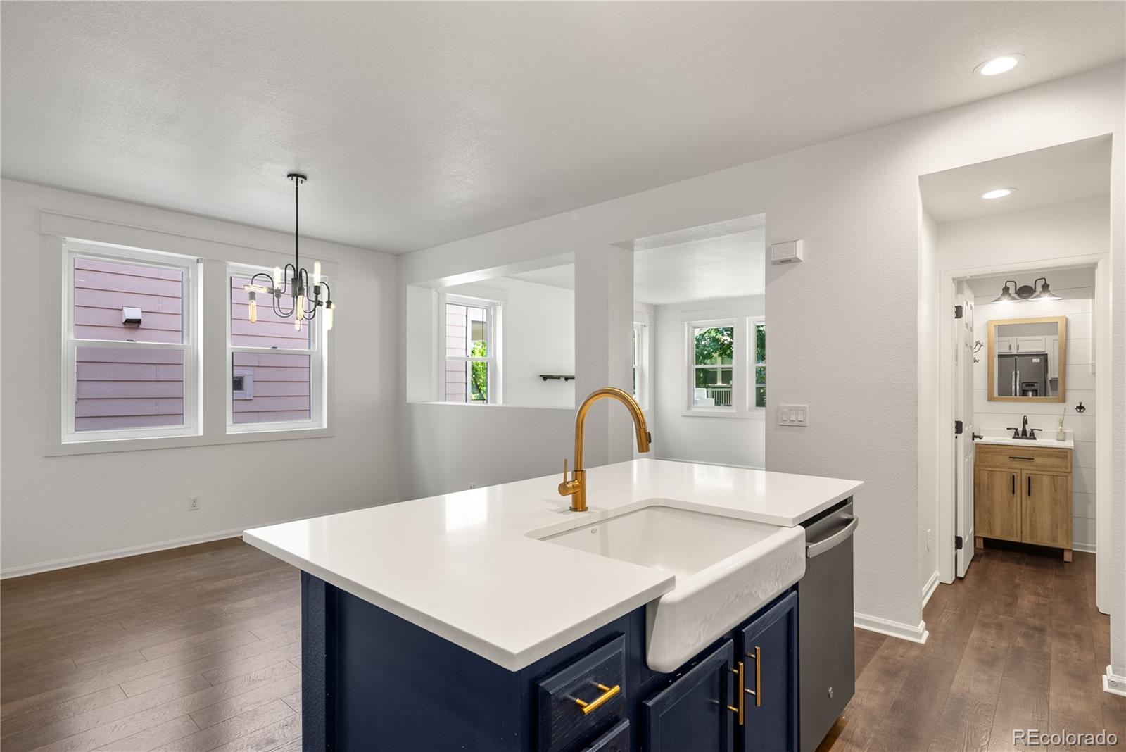 2883 Central Park Boulevard Denver, CO 80238 - Photo 9 of 27 a kitchen with a sink cabinets and wooden floor