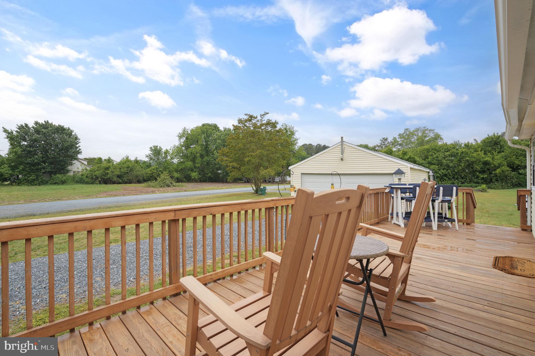 7278 Fleming Road New Church, VA 23415 - Photo 30 of 44 a view of a patio on wooden deck and a backyard