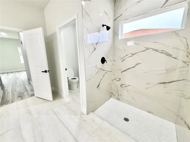 a bathroom with a tub and a shower