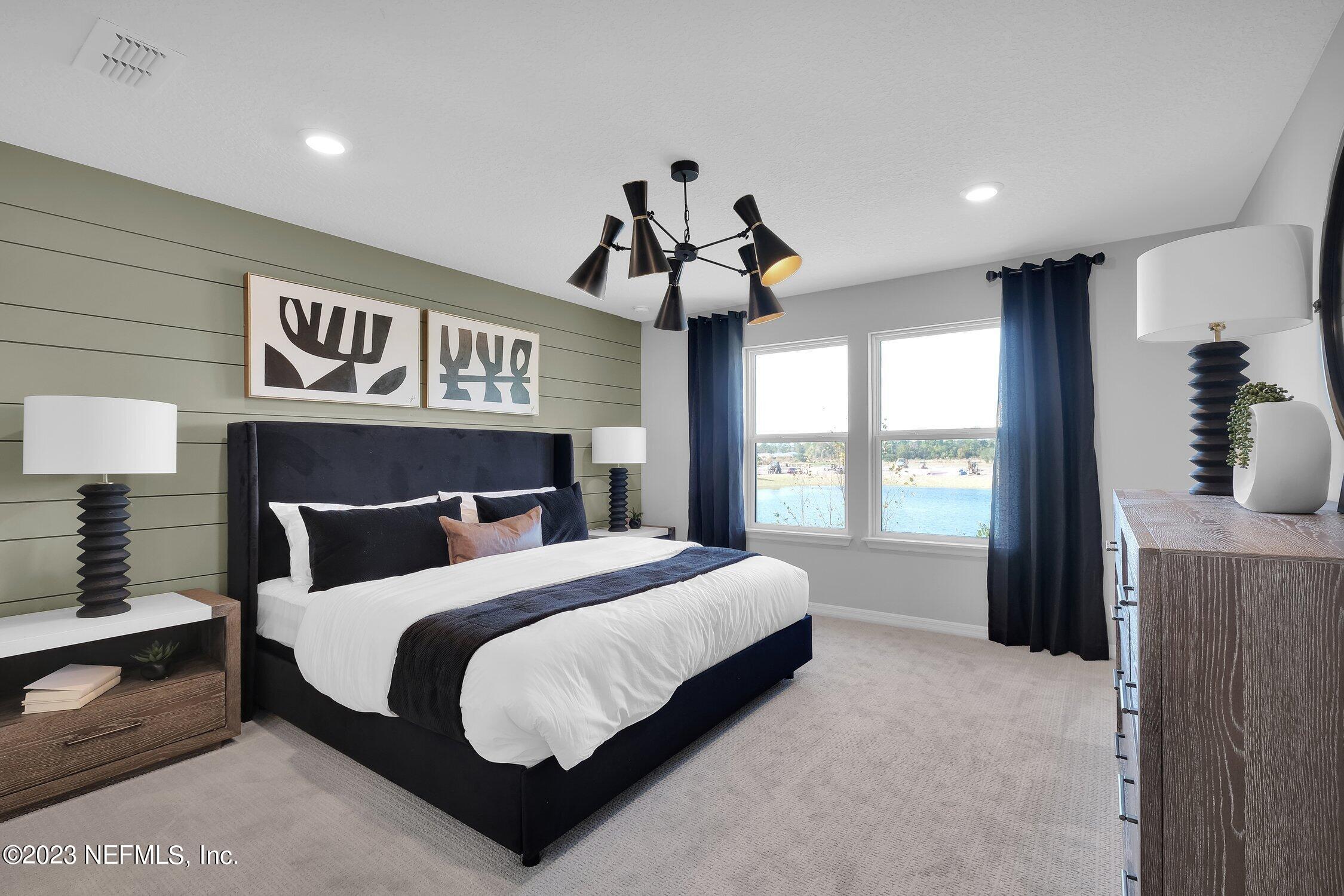 731 Blind Oak Circle St. Augustine, FL 32095 - Photo 15 of 34 a bedroom with a bed and window