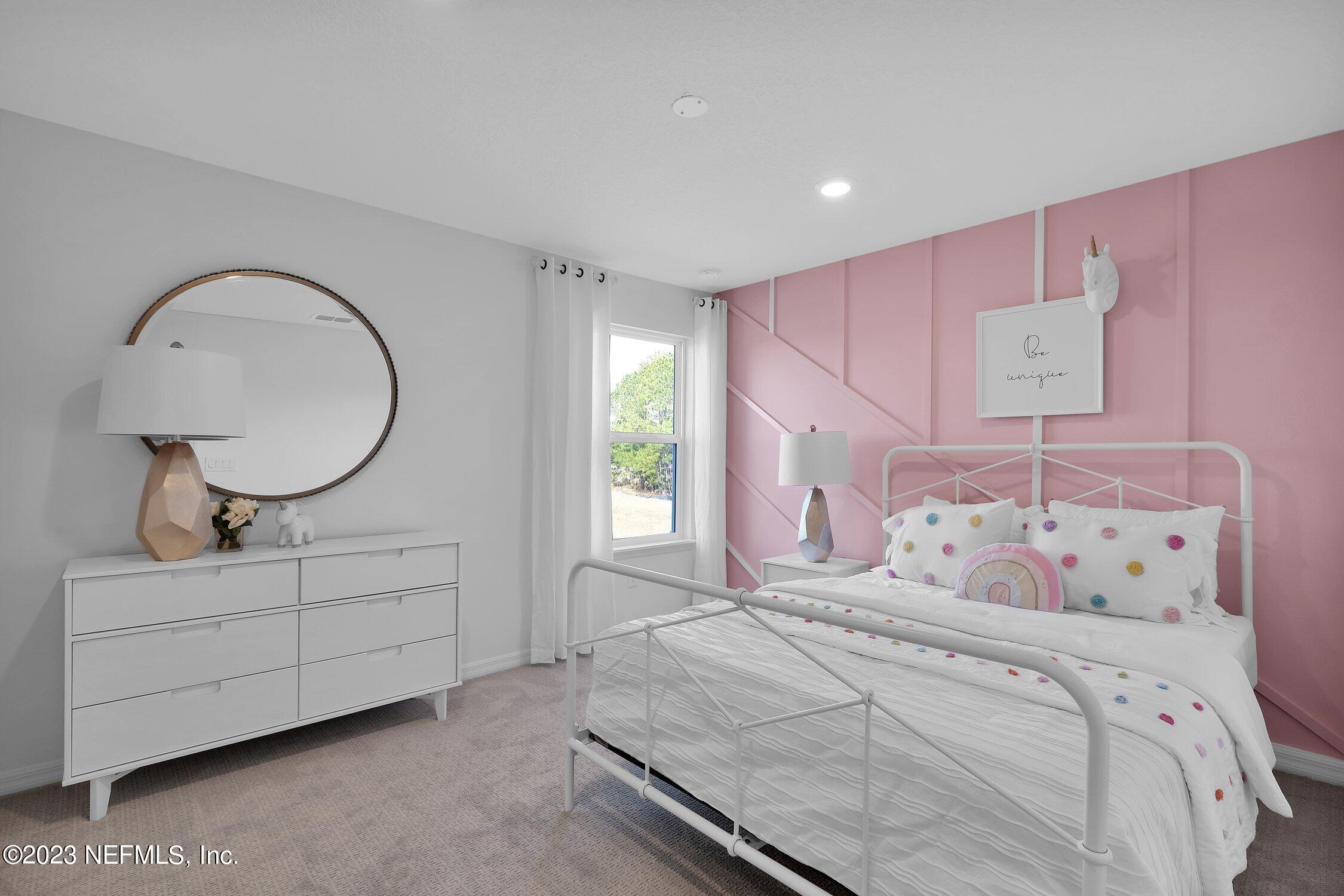 731 Blind Oak Circle St. Augustine, FL 32095 - Photo 25 of 34 a bedroom with a bed and a dresser