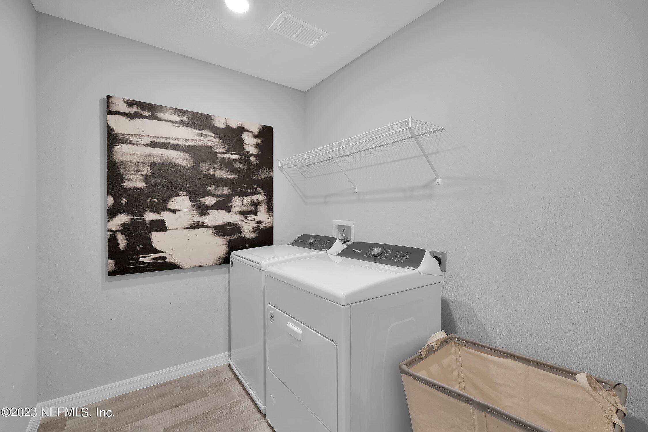 731 Blind Oak Circle St. Augustine, FL 32095 - Photo 26 of 34 a utility room with dryer and washer