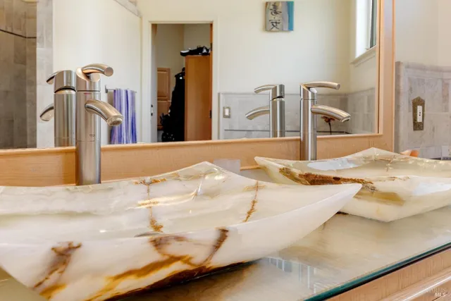 a kitchen with stainless steel appliances a refrigerator sink and cabinets