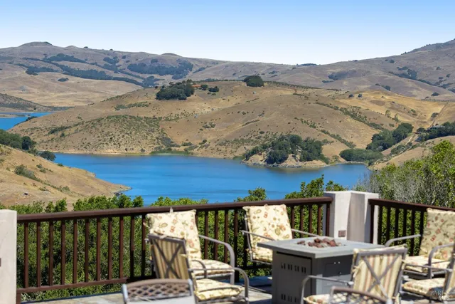 a view of a balcony with wooden floor and city view