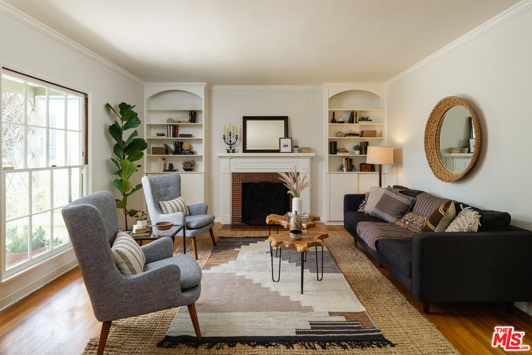 1422 Maple Street South Pasadena, CA 91030 - Photo 11 of 45 a living room with furniture a rug a fireplace and a large window