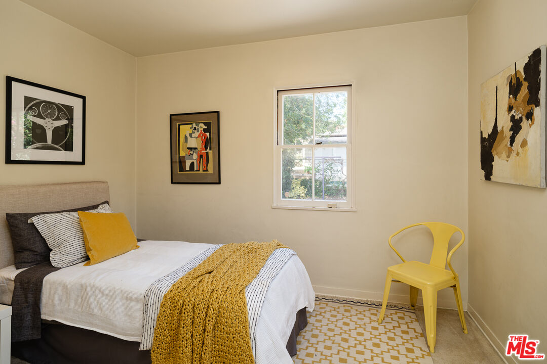 1422 Maple Street South Pasadena, CA 91030 - Photo 27 of 45 a bedroom with a bed and a chair