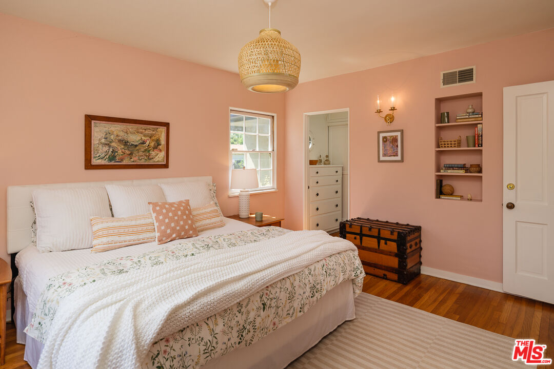 1422 Maple Street South Pasadena, CA 91030 - Photo 30 of 45 a bedroom with a bed and a chandelier