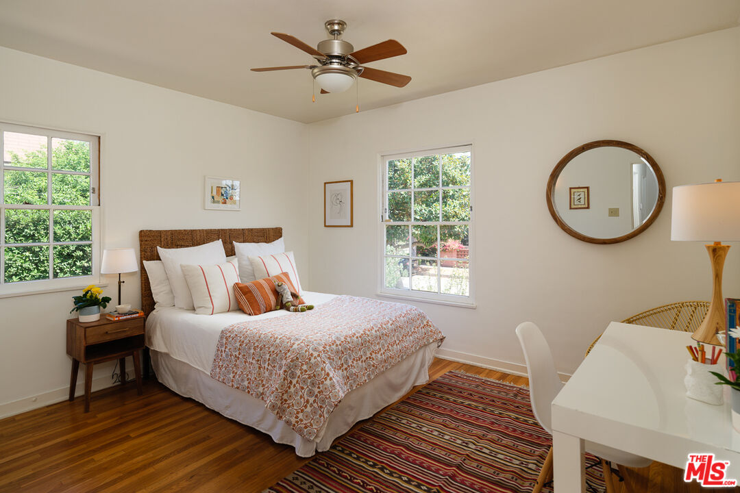 1422 Maple Street South Pasadena, CA 91030 - Photo 31 of 45 a bedroom with a bed and a chandelier