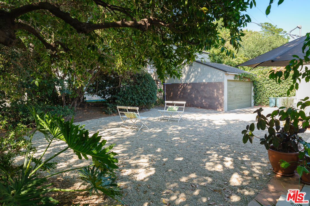 1422 Maple Street South Pasadena, CA 91030 - Photo 38 of 45 a backyard of a house with table and chairs and potted plants