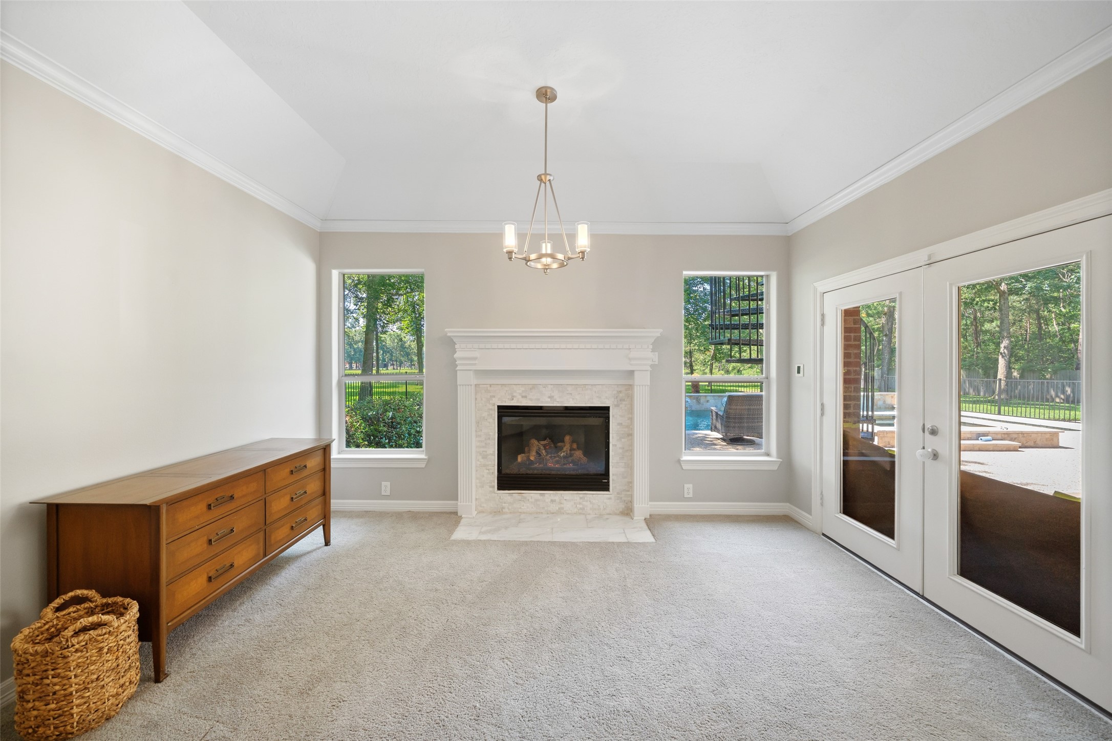 2302 Legends Shore Drive Spring, TX 77386 - Photo 28 of 48 Cozy fireplace creates a warm focal point in the primary suite.