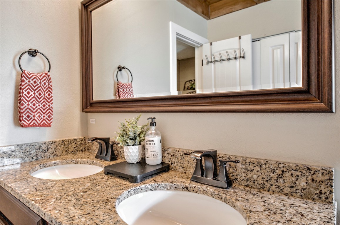 8500 Ryan Gulch Road, Unit G3 Silverthorne, CO 80498 - Photo 17 of 28 a bathroom with a sink and a mirror