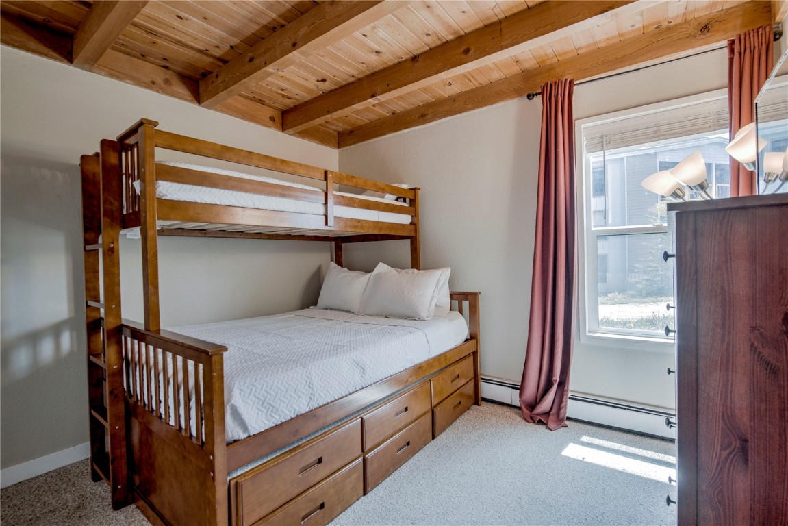 8500 Ryan Gulch Road, Unit G3 Silverthorne, CO 80498 - Photo 18 of 28 a bedroom with bed and a window