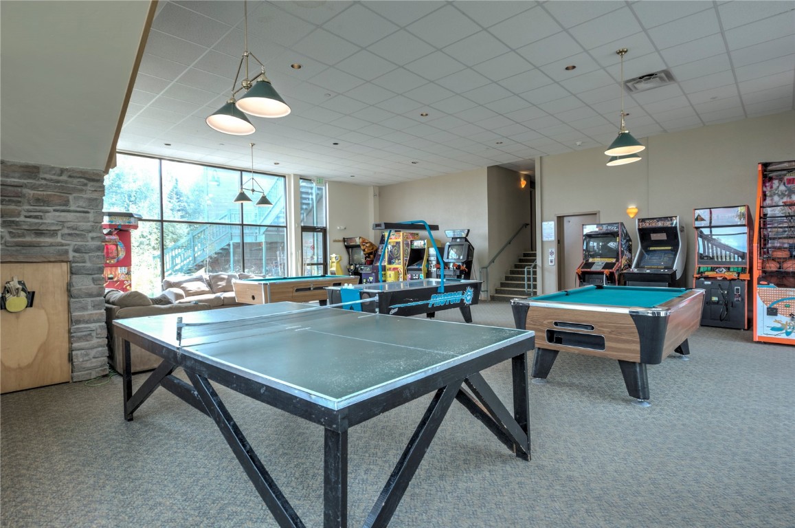 8500 Ryan Gulch Road, Unit G3 Silverthorne, CO 80498 - Photo 23 of 28 a room with pool table and windows