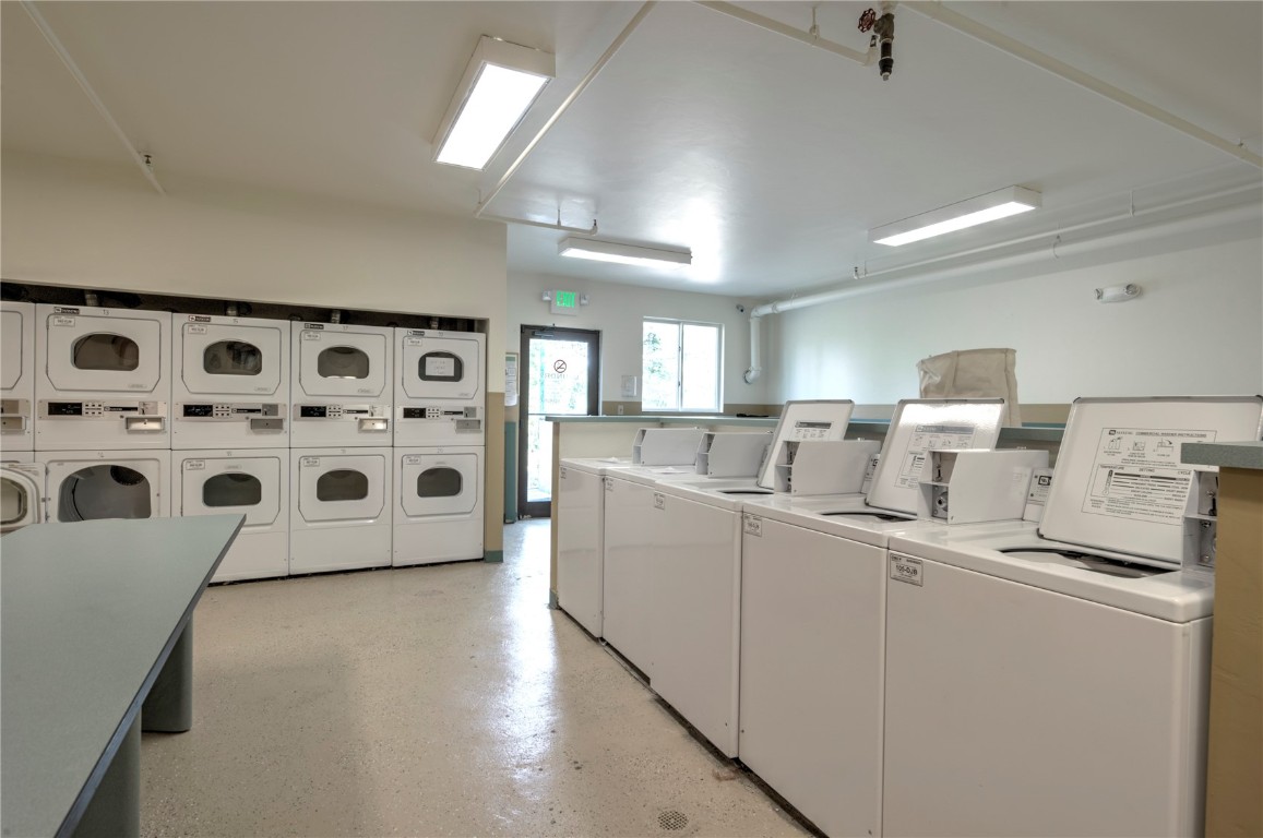 8500 Ryan Gulch Road, Unit G3 Silverthorne, CO 80498 - Photo 27 of 28 a view of kitchen with stainless steel appliances a sink a stove a refrigerator with white cabinets