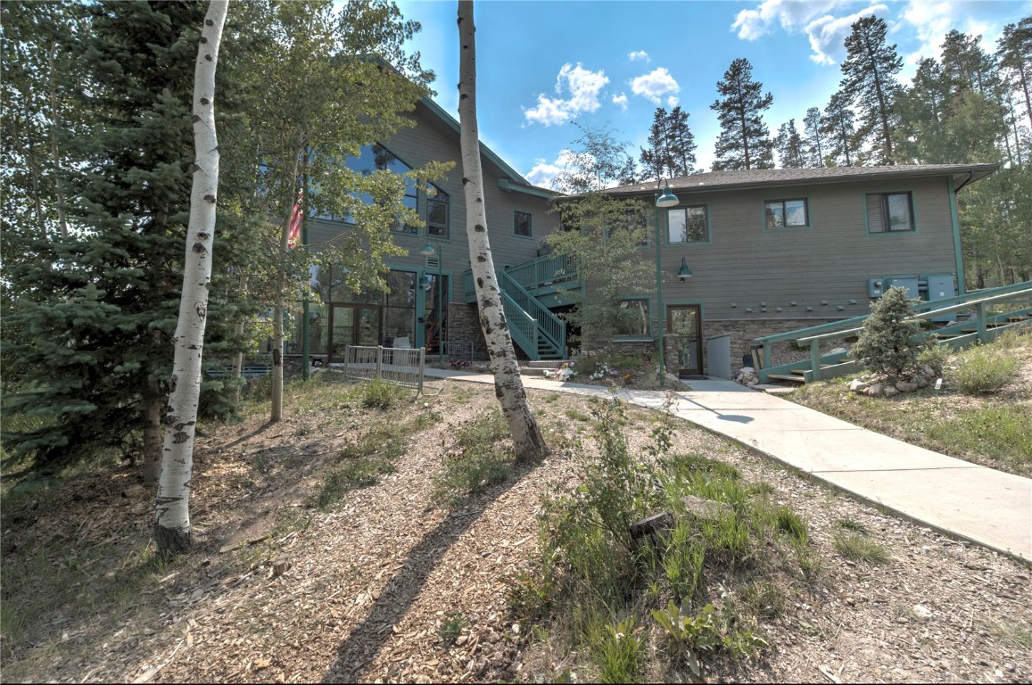 8500 Ryan Gulch Road, Unit G3 Silverthorne, CO 80498 - Photo 28 of 28 a view of a house with a yard and pathway