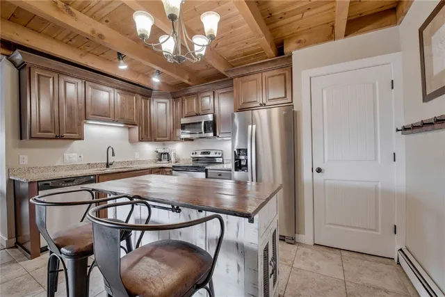 a kitchen with a sink stove and refrigerator