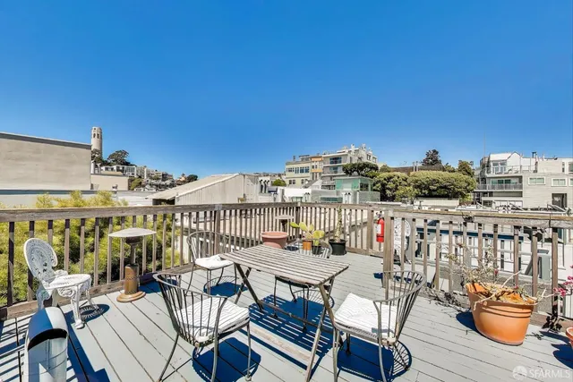 a view of a balcony with chairs