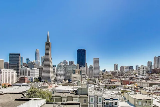 a view of a street with a building in the background