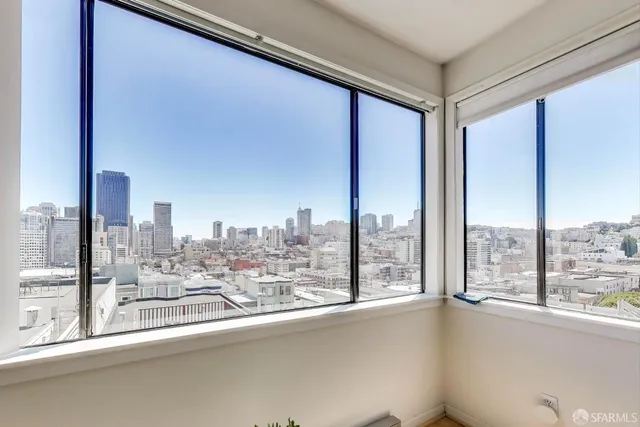 a bed room with a bed and a large window