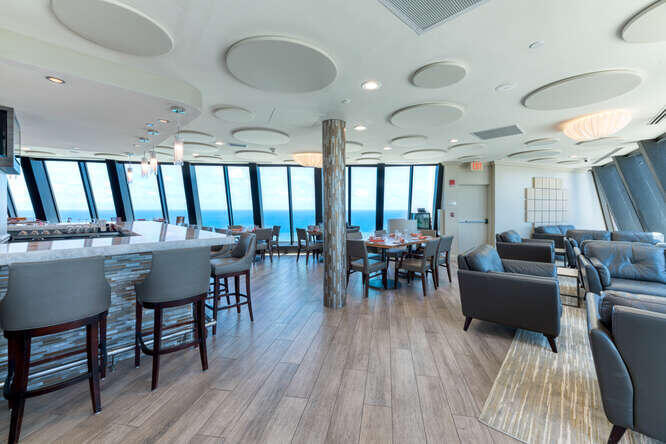 3000 North Ocean Drive, Unit 36C Riviera Beach, FL 33404 - Photo 13 of 18 a view of a dining room with furniture and wooden floor