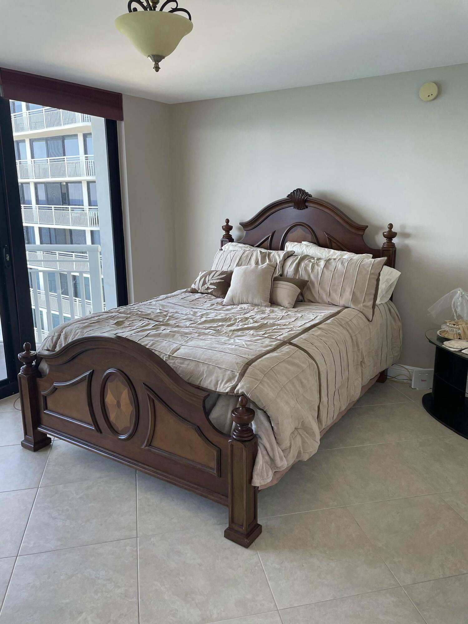 3000 North Ocean Drive, Unit 36C Riviera Beach, FL 33404 - Photo 6 of 18 a bedroom with a bed and a window