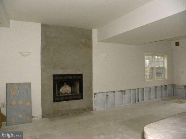 1108 Meredith Lane Davidsonville, MD 21035 - Photo 17 of 24 a living room with furniture and a fireplace