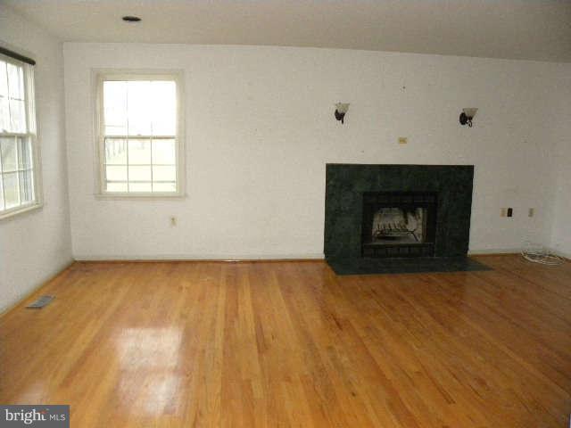 1108 Meredith Lane Davidsonville, MD 21035 - Photo 3 of 24 a view of an empty room with wooden floor and a window
