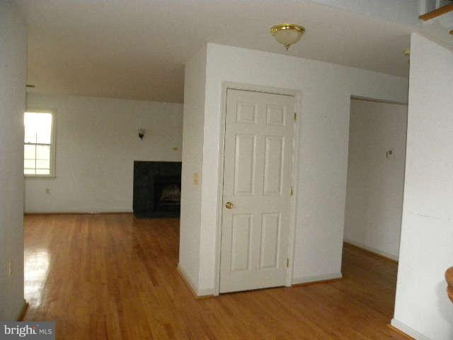 1108 Meredith Lane Davidsonville, MD 21035 - Photo 4 of 24 a view of a livingroom with wooden floor and cabinet
