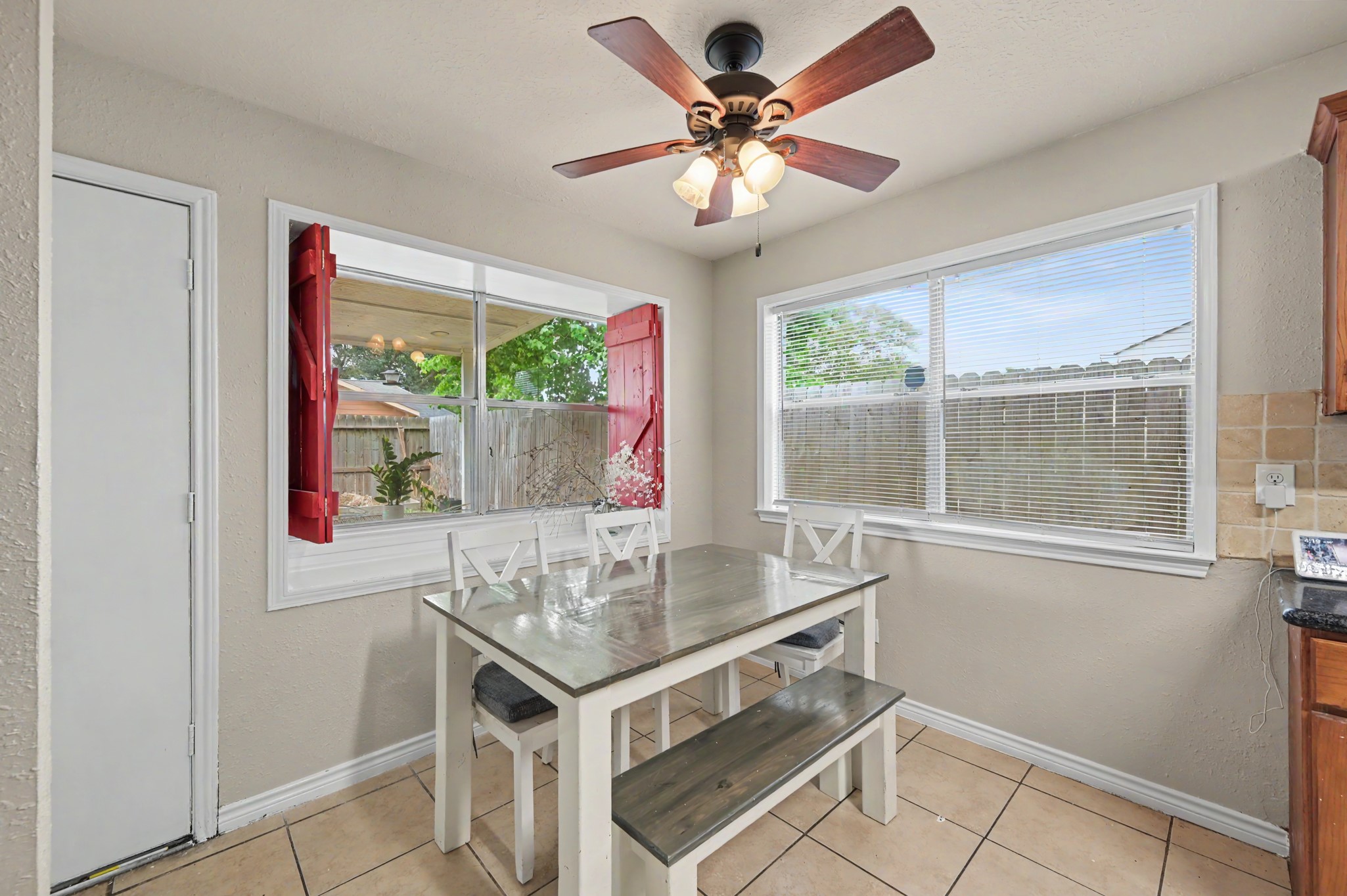 5226 Clarkston Lane Spring, TX 77379 - Photo 10 of 25 Charming breakfast nook with abundant natural light. Decorative red shutters and a shelf for all your seasonal decorations!