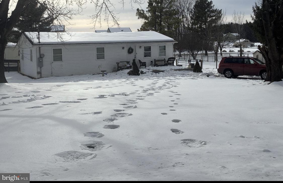 297 Weeping Willow Road Falling Waters, WV 25419 - Photo 1 of 1 a view of a house with a yard covered in snow