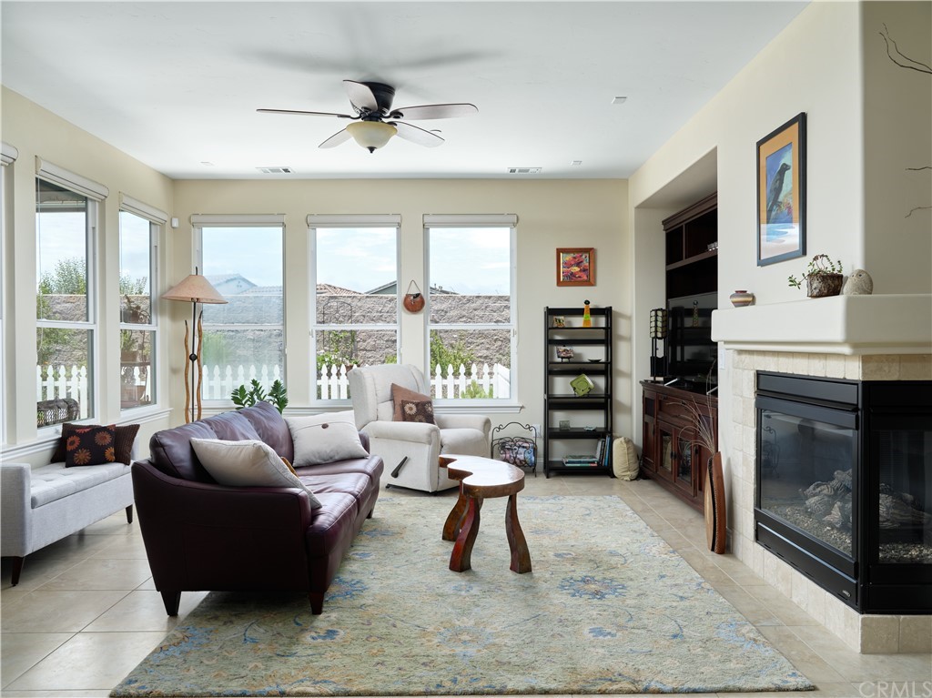 1156 Saltillo Way Nipomo, CA 93444 - Photo 4 of 29 a living room with furniture a flat screen tv and a fireplace