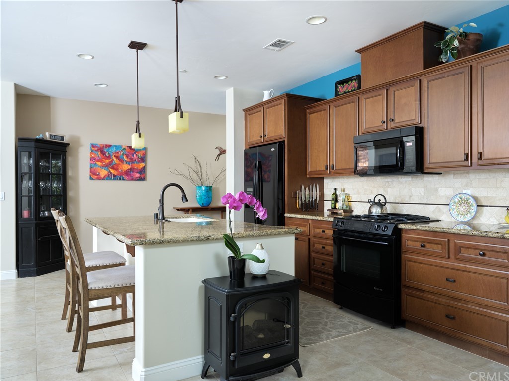 1156 Saltillo Way Nipomo, CA 93444 - Photo 5 of 29 a kitchen with a sink cabinets and window