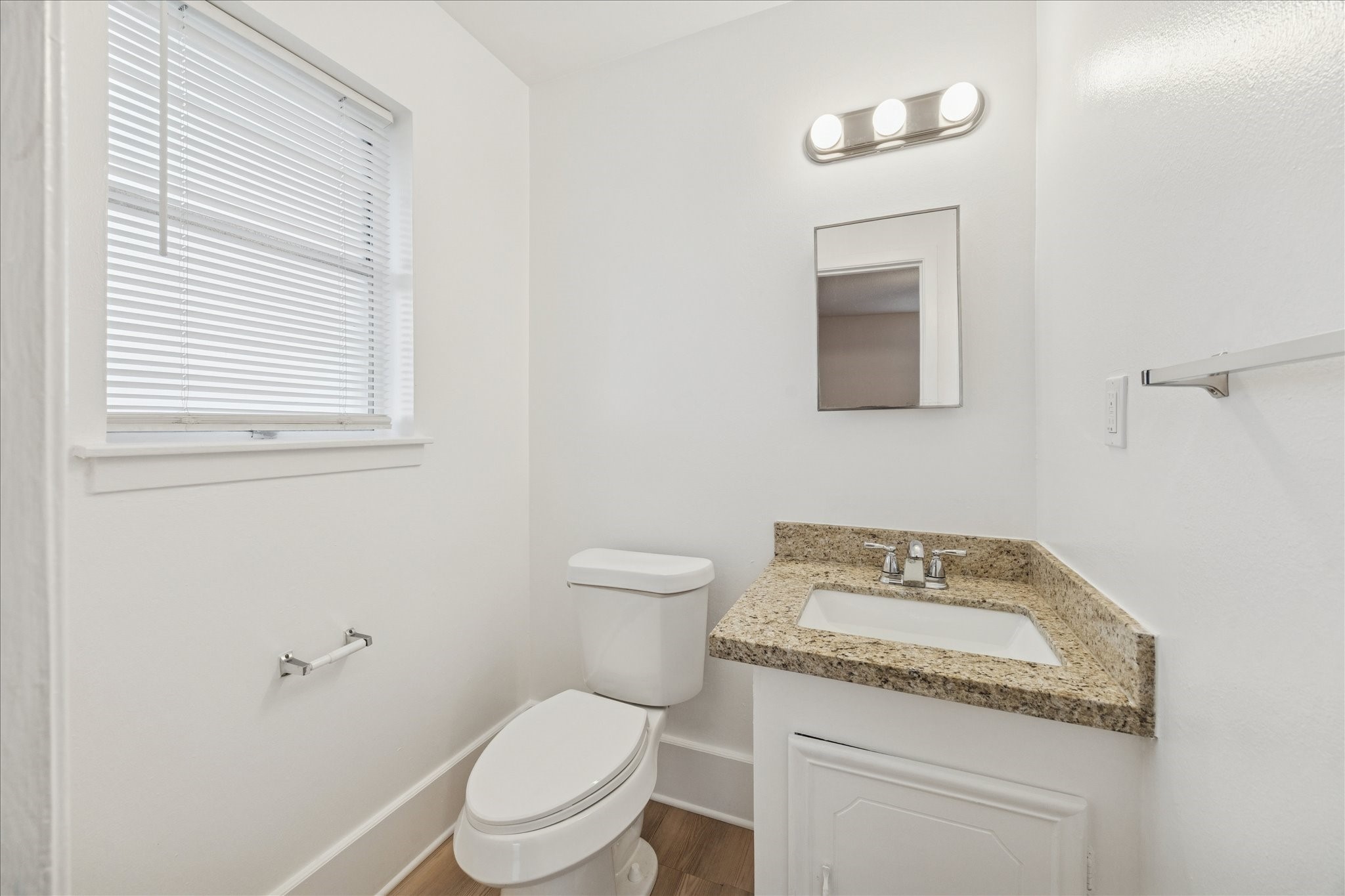 431 Hummingbird Lane Houston, TX 77060 - Photo 15 of 22 a white toilet sitting next to a bathroom sink