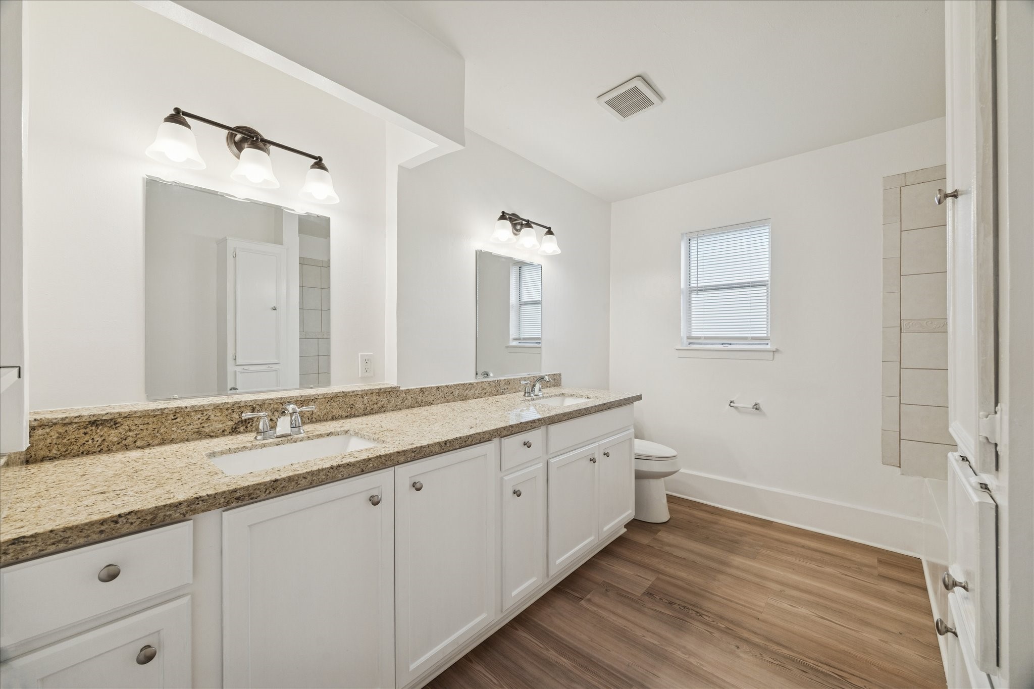 431 Hummingbird Lane Houston, TX 77060 - Photo 17 of 22 a spacious bathroom with a granite countertop sink mirror and a