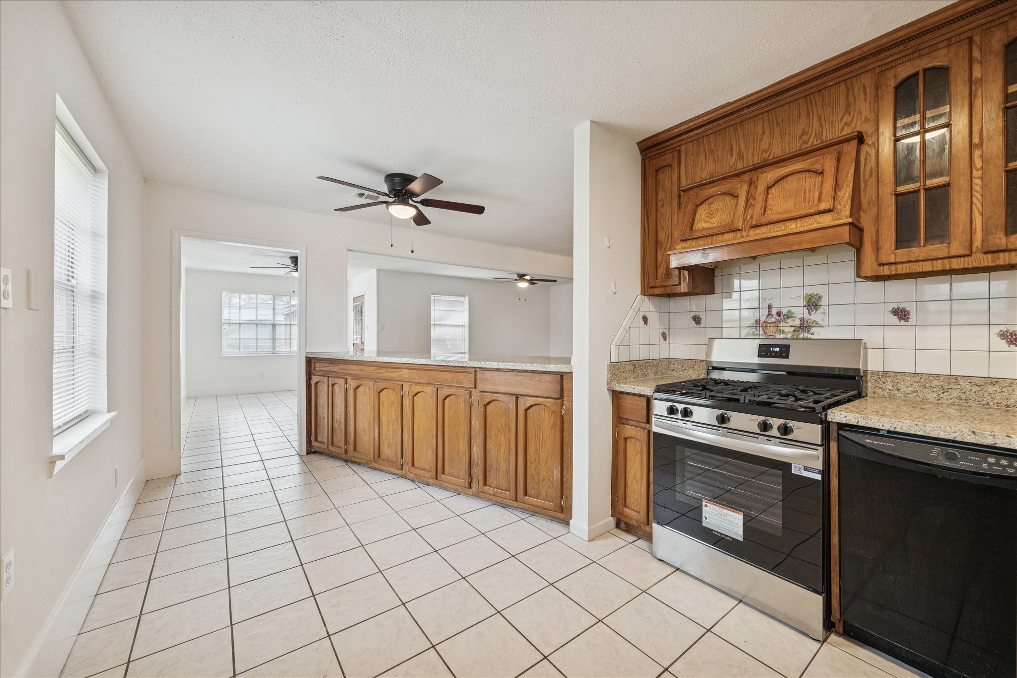 431 Hummingbird Lane Houston, TX 77060 - Photo 6 of 22 a kitchen with stainless steel appliances granite countertop a stove a sink and a refrigerator