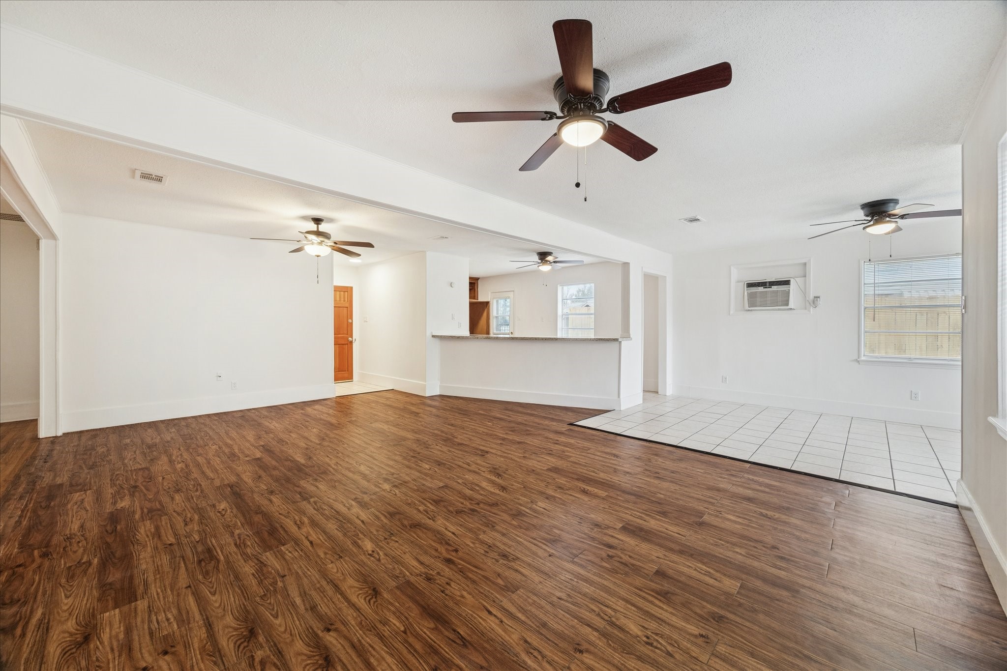 431 Hummingbird Lane Houston, TX 77060 - Photo 10 of 22 a view of empty room with wooden floor and ceiling fan