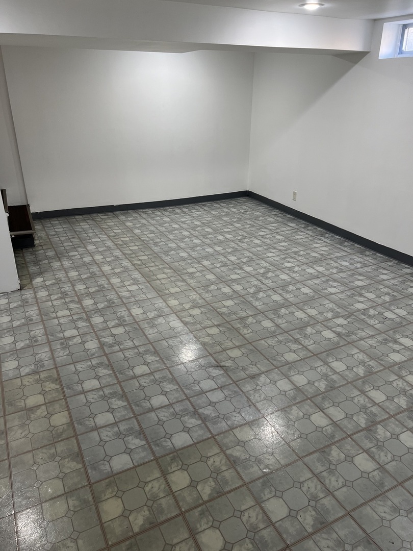 9559 Sumac Road, Unit F Des Plaines, IL 60016 - Photo 19 of 24 a view of a room with an empty space