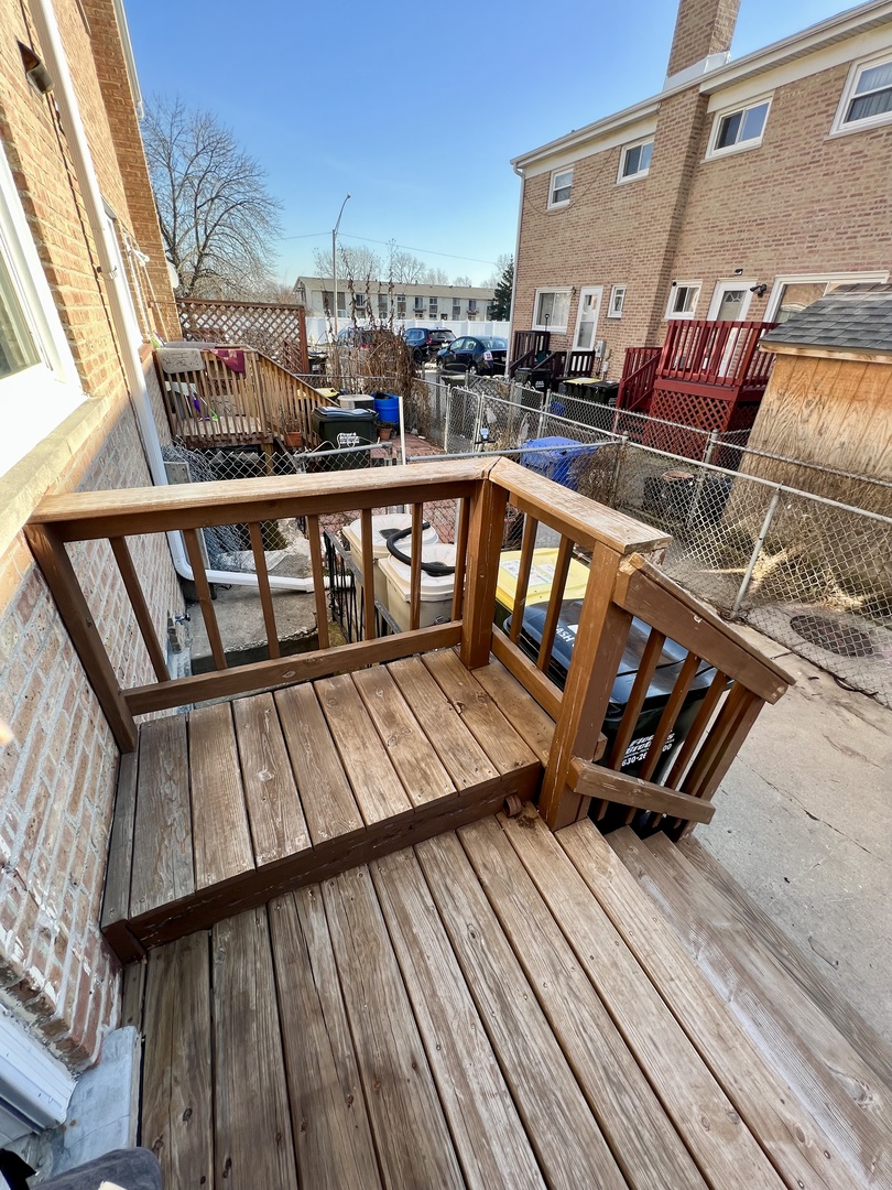9559 Sumac Road, Unit F Des Plaines, IL 60016 - Photo 23 of 24 a view of a balcony with wooden floor