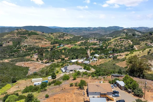 an aerial view of residential house and outdoor space