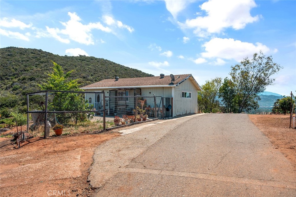 1996 Rainbow Glen Fallbrook, CA 92028 - Photo 22 of 55 a house with trees in the background