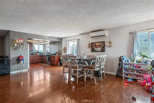 a large kitchen with stainless steel appliances granite countertop a sink stove and cabinets