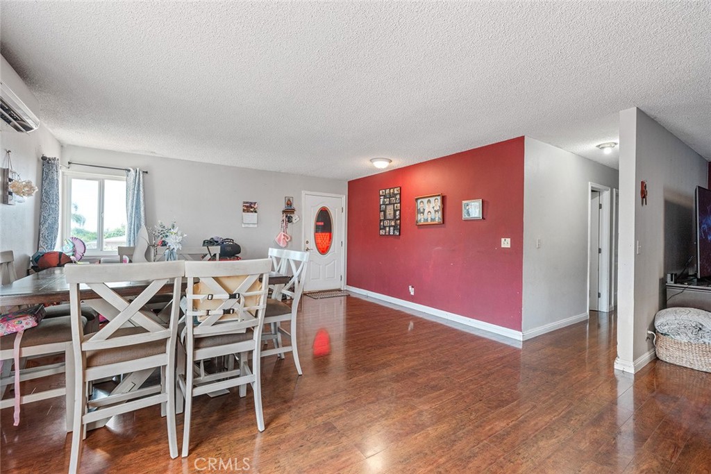 1996 Rainbow Glen Fallbrook, CA 92028 - Photo 25 of 55 a view of a dining room with furniture and wooden floor