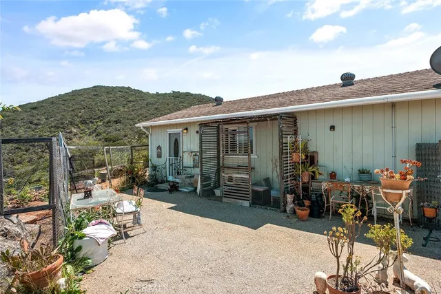 a bathroom with a toilet a sink and a mirror